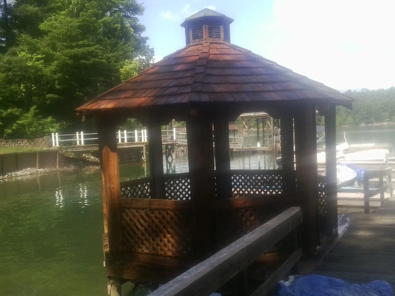 Cedar shake gazebo roof rebuilt on a lake dock in Montour